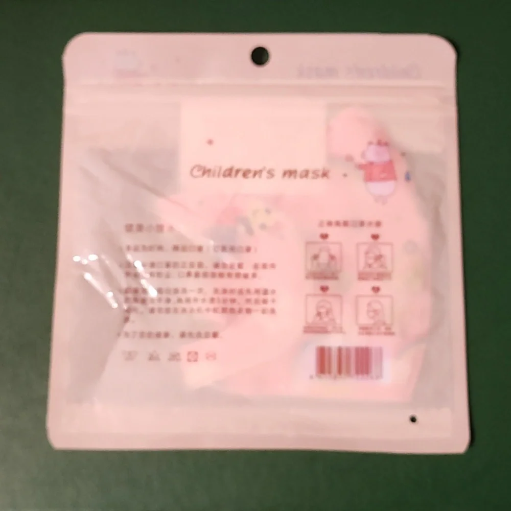 Children's re Usable face mask new in package never opened